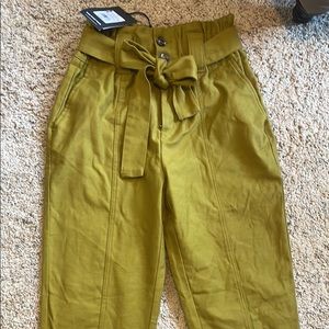 Mustard colored paper bag style pants